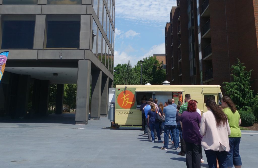A food truck in the plaza at Nova Place
